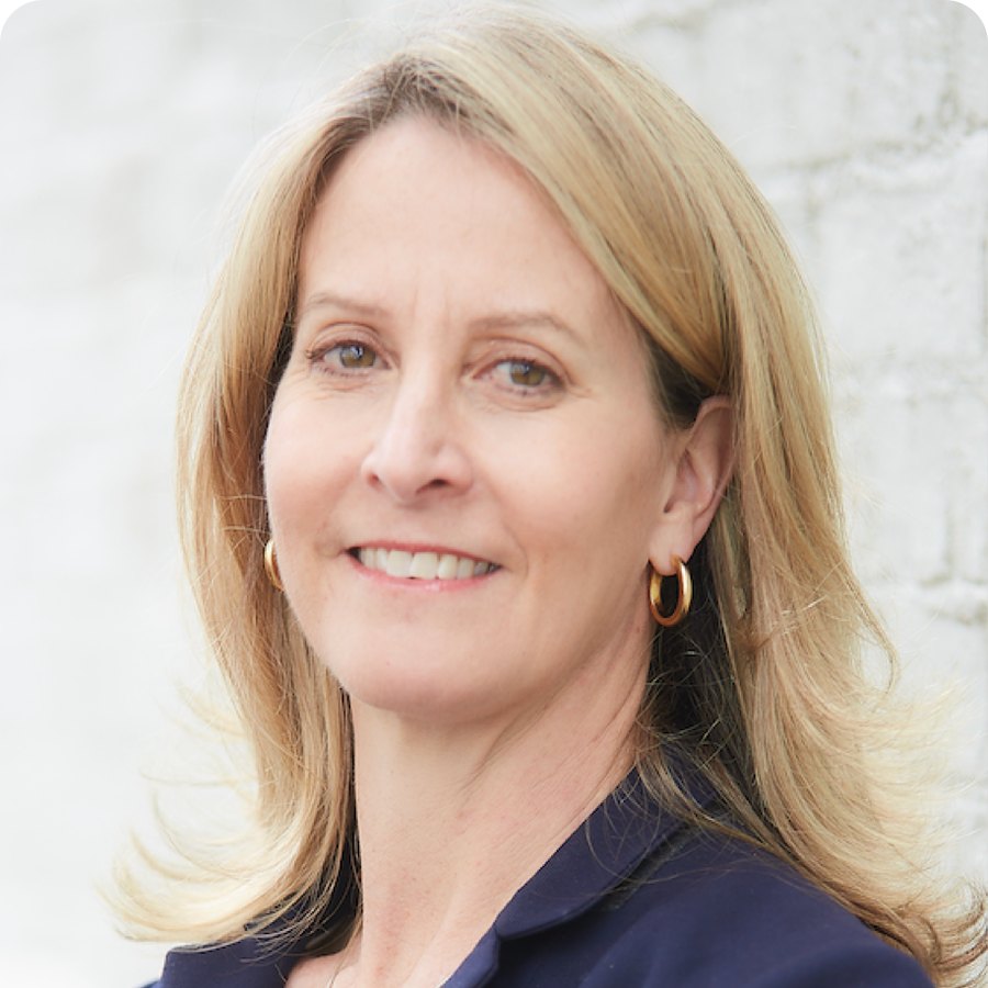Jenny Anderson, smiling, with shoulder-length blond hair